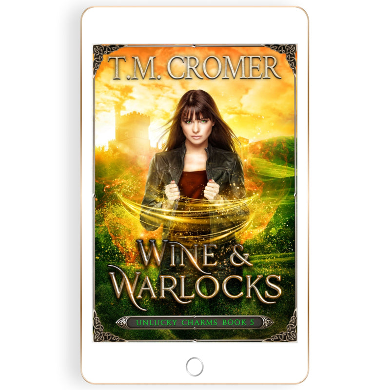 Book cover of 'Wine & Warlocks' by T.M. Cromer on a tablet device.